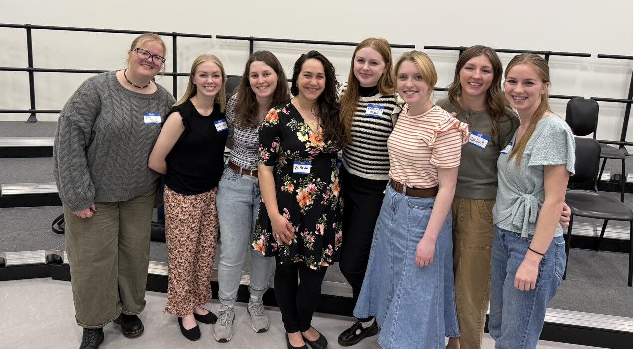 Utah Flute Association volunteers and collegiate participants gathered at an event